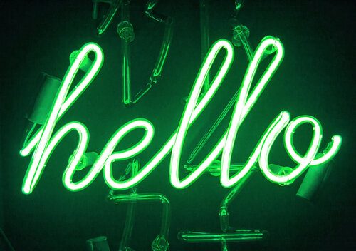 A green neon hello sign